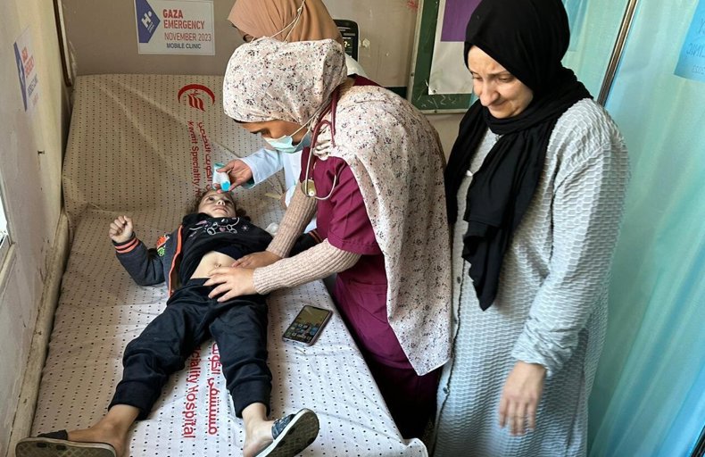 Child being tended to in Human Appeal's mobile clinic