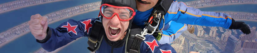 A pair of people skydiving